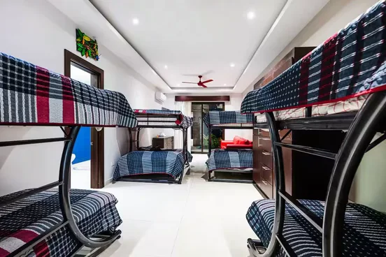 Shared room with three sets of bunk beds, sleeping six