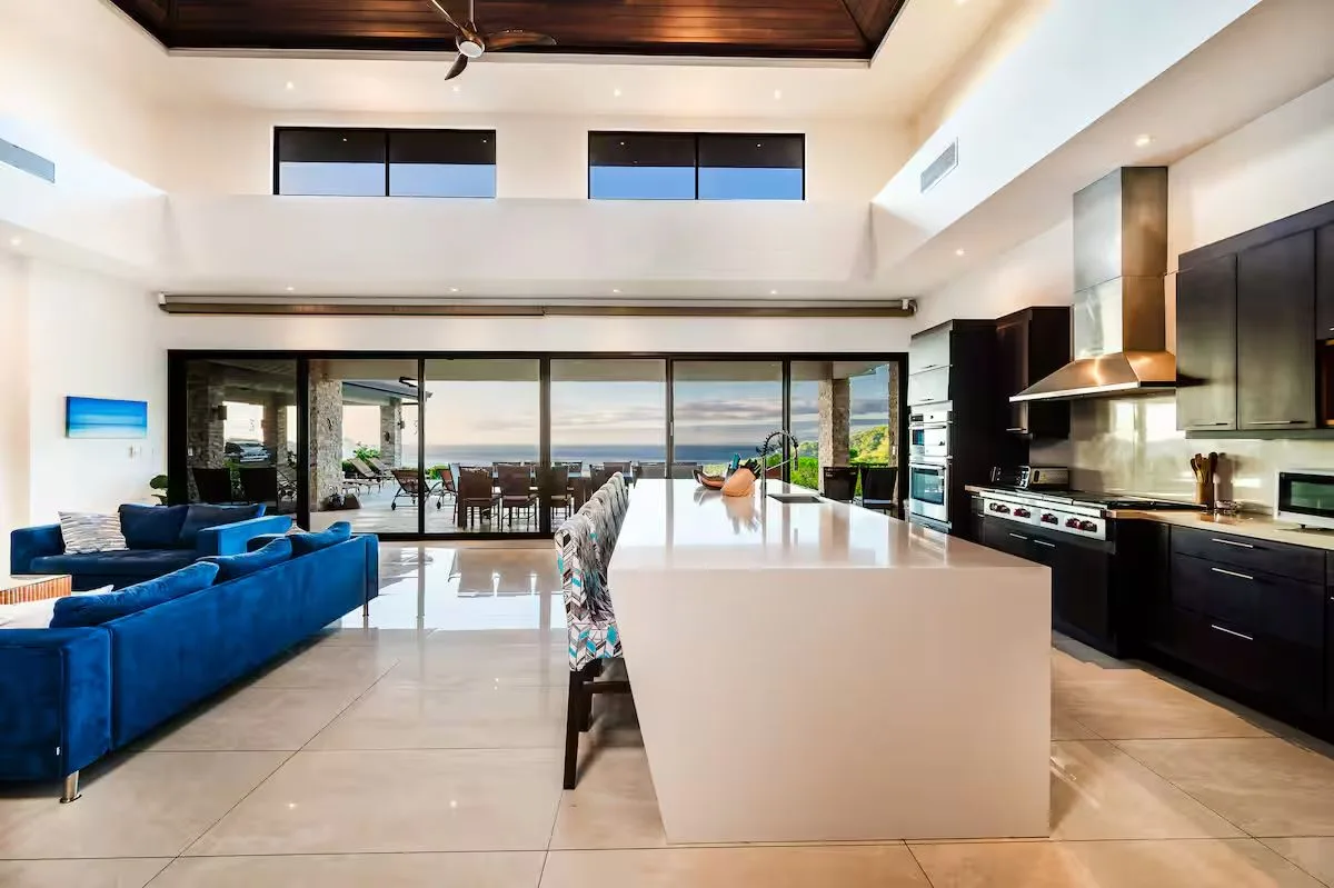 Open kitchen and island opening onto the terrace and ocean view